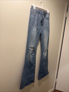 Fashion Nova Light Blue Distressed Flared Jeans